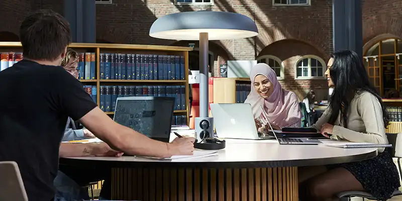 Four students sitting in the KTH Library