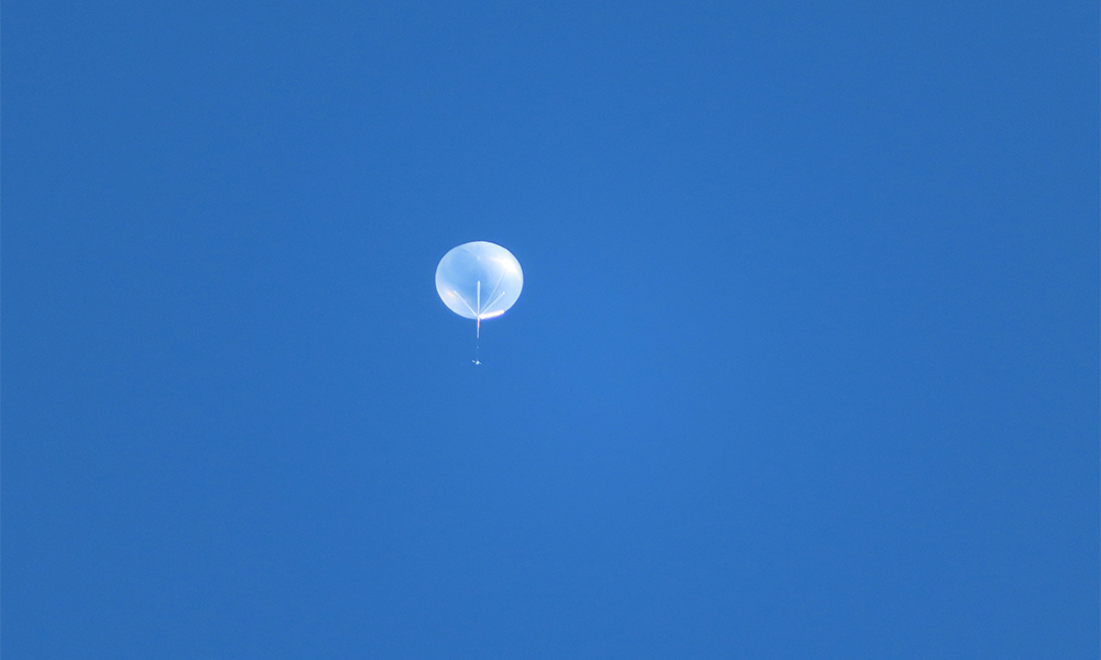 white balloon in blue sky