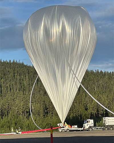 A white space ballon half filled with air, ready to launch from Esrange