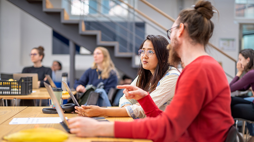 Students around a table.