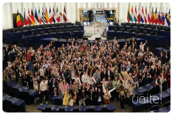 A large number of students at a meeting