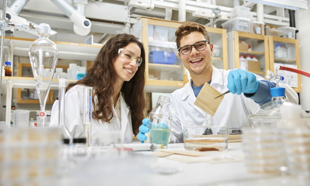 Two chemistry students in a lab